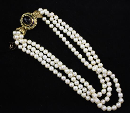 A triple strand cultured pearl choker necklace,